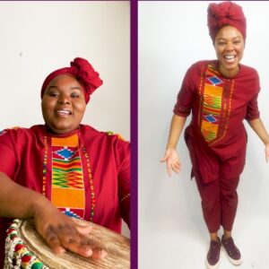 Left side of the photo is a Black woman sitting with hand on drum wearing traditional African clothing. On righthand side is a black women standing and laughing at camera. She is wearing traditional red African Clothing and head wrap.