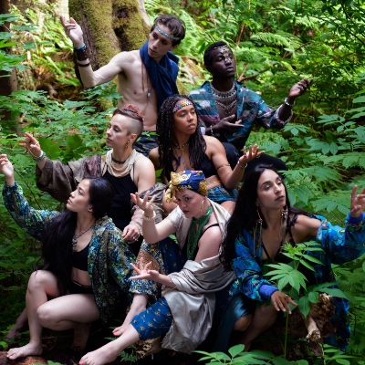 Her Tribal roots dancers posing together in the forest