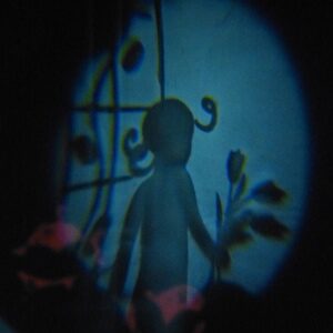 silhouette of a girl with pigtails holding some tulips