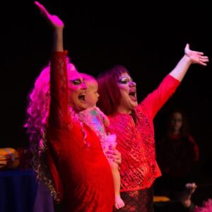 Photo of drag performers waving and smiling, from the Parents are still a drag performance taking place June 3rd-5th.