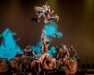 Image of circus performers from the Won’Ma Africa group throwing one member in the air. Join us on May 31st-June 5th for this thrilling performance.