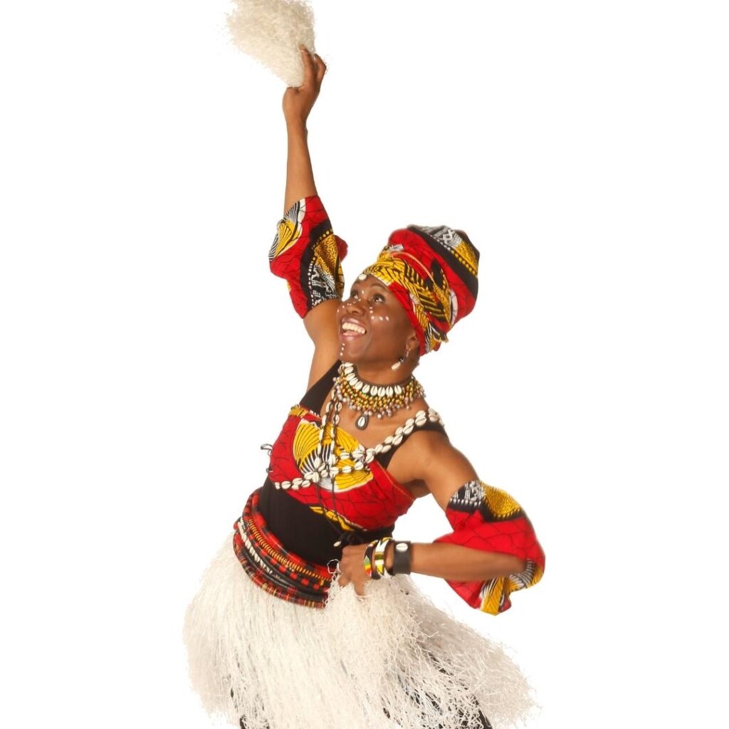 Image of woman dancing and smiling from the Africa Oyé dance party, happening June 1st-4th.