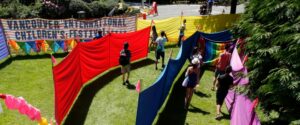 mage of people walking through a brightly coloured outdoor maze