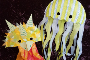 Jellyfish and Dragon masks made from tissue paper at our mask-making workshop