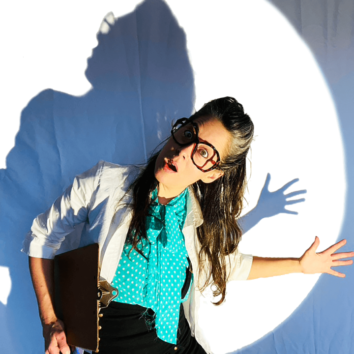 Candice Roberts holding a clipboard, and their shadow cast behind them