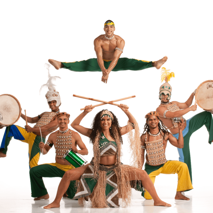 men and women posing while playing the drums and doing the splits