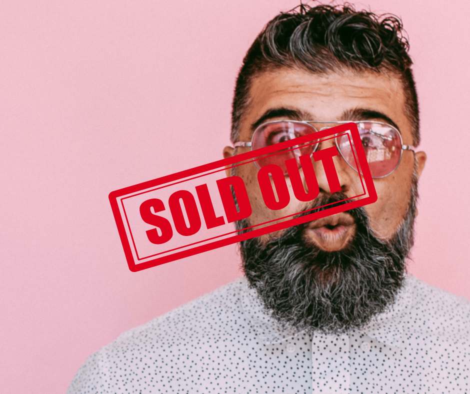 Ruploops wearing a white shirt and pink tinted glasses, with a pink backdrop. There is big red text over the centre of the image displaying that his performance has been sold out.