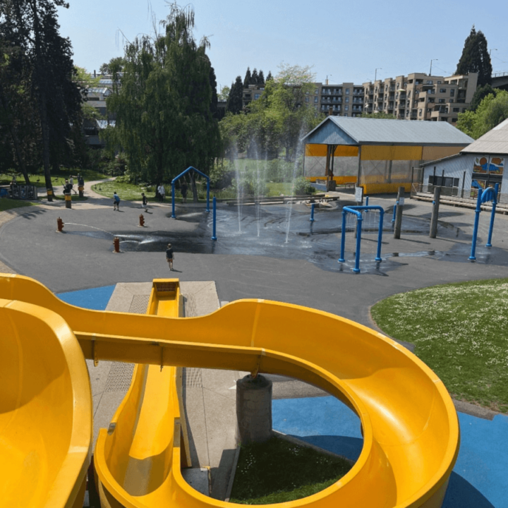 A picture taken from the top of the big yellow waterslide, at Sutcliffe Park's waterpark on Granville Island.