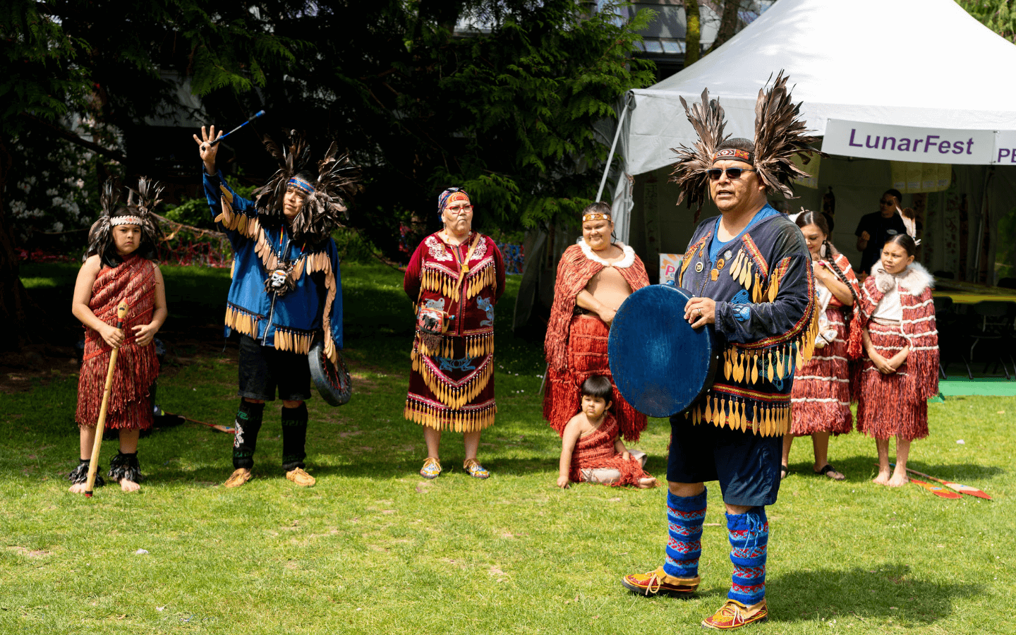 A group from Tsatsu Stalqayu wear traditional Indigenous clothing.
