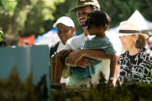 A family looks at the miniature railway.