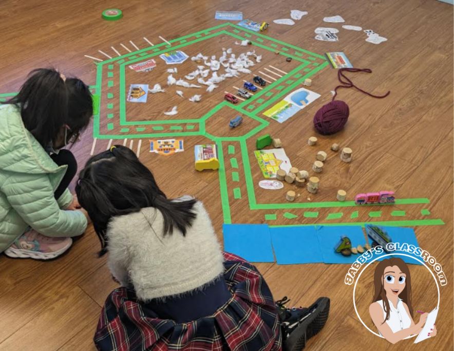 Two students are working on a school assignment on the floor.